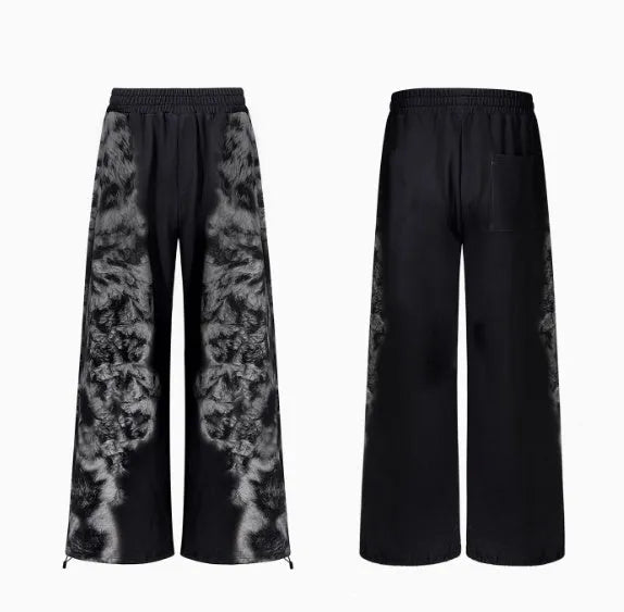 Loose-fit printed polyester streetwear co-ord set showing trousers, seven-inch shorts, and a hoodie on a hanger.