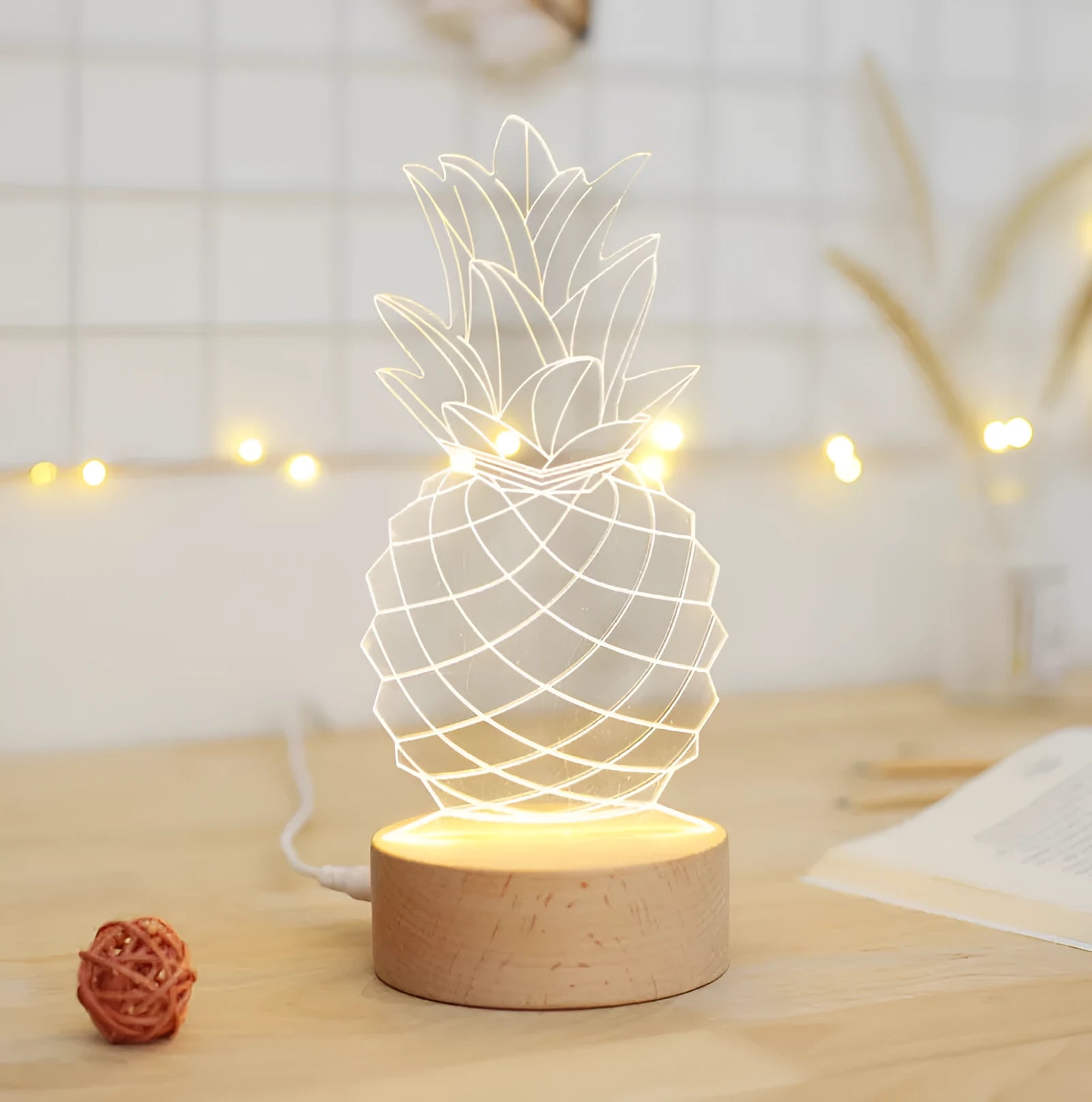 Pineapple-shaped dimmable bedside table lamp with wood and acrylic construction on a nightstand.