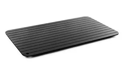 Black aluminium quick defrosting tray for thawing frozen meat and food without electricity.