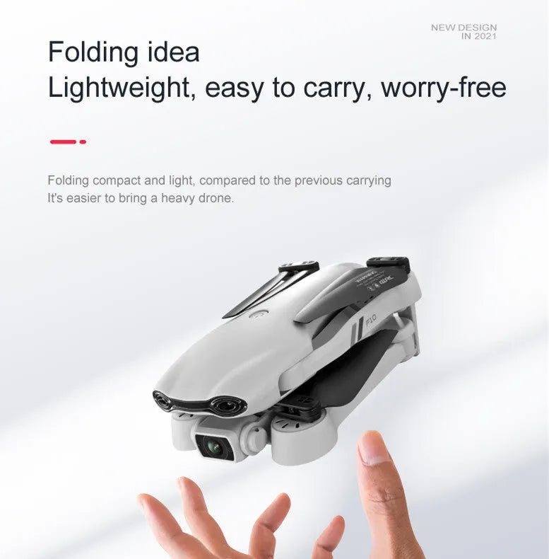F10 folding GPS drone with 6K dual camera unfolded on a table showing propellers and camera