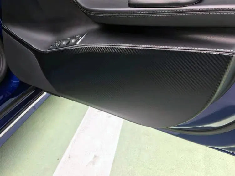Clear carbon fibre protective film kit for Tesla Model S car door interior panels.