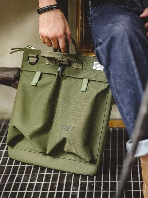 Canvas crossbody messenger bag in retro style with shoulder strap, showing internal phone pocket and 15-inch laptop capacity