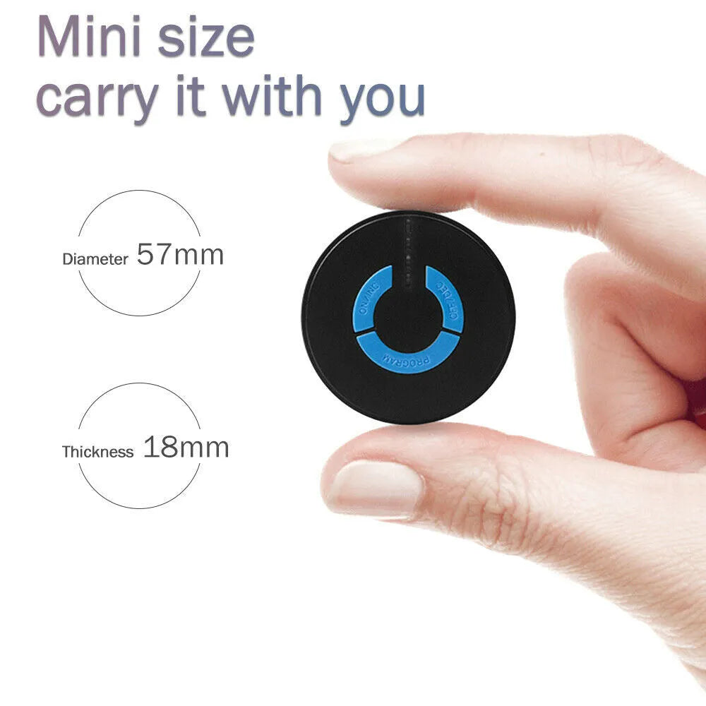 Black HQ-185 mini electric shoulder and neck massager with massage patch, shown next to a ruler for scale.