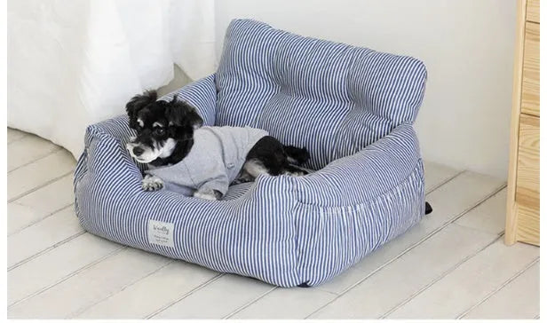 Canvas pet car seat cushion in striped pattern, set on a car seat with raised sides