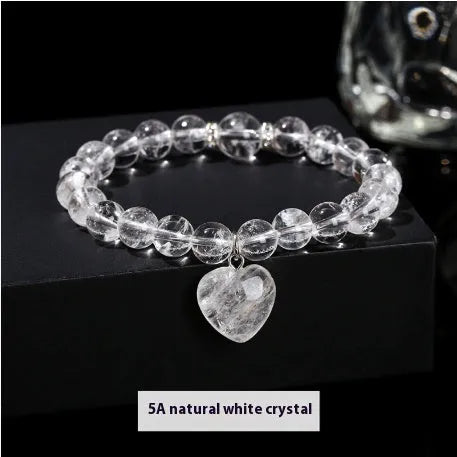 Handmade women's bracelet with geometric pendant and round natural crystal beads.