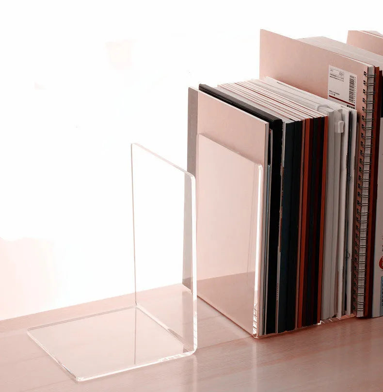Transparent acrylic bookshelf displaying two books on a desk