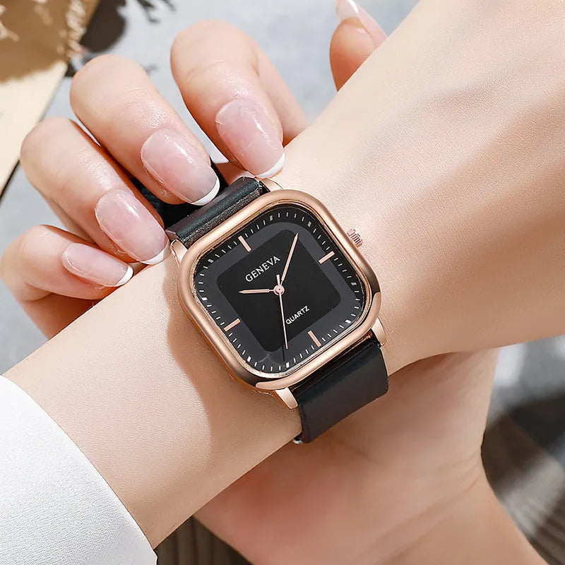 Women's rose gold square dial quartz watch with plastic strap on white background