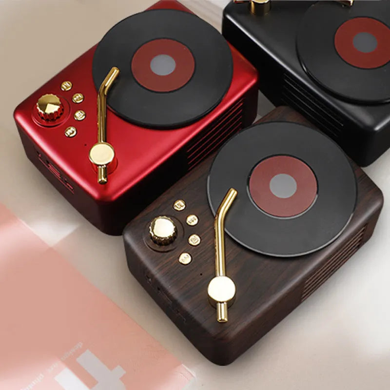 T12 record player with Bluetooth 5.0 in black, showing top view with vinyl record on platter and control buttons