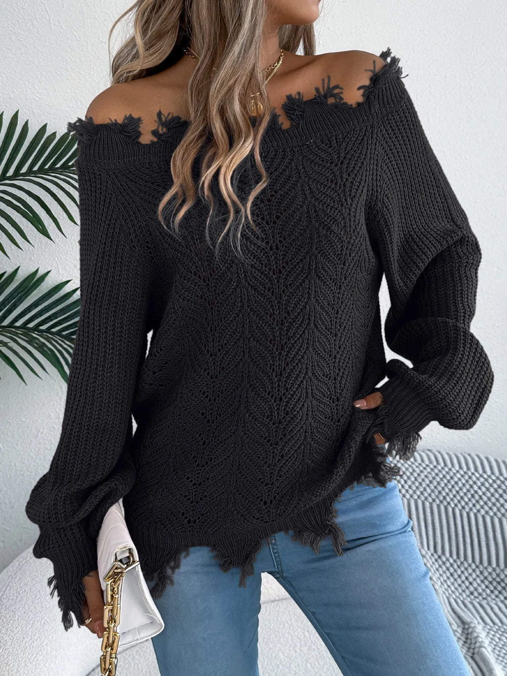 Hollow-out long-sleeved off-the-shoulder pullover sweater in artificial wool acrylic fibre available in black, orange, and white colours