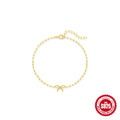 Close-up of a women's sterling silver bracelet with a glossy heart charm on an adjustable clip chain.