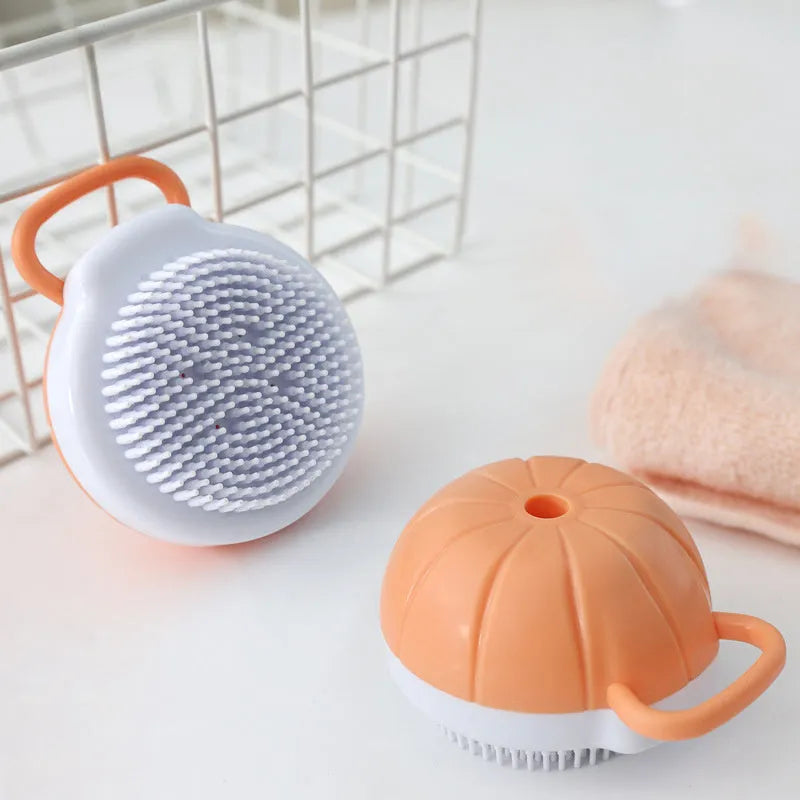 Orange TPR dog bath brush with shampoo dispenser, massage bristles and comb teeth.