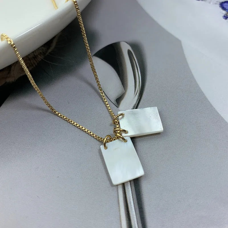 White mother pearl shellfish Jesus Virgin Mary pendant on a 45cm alloy box chain with electroplated white finish