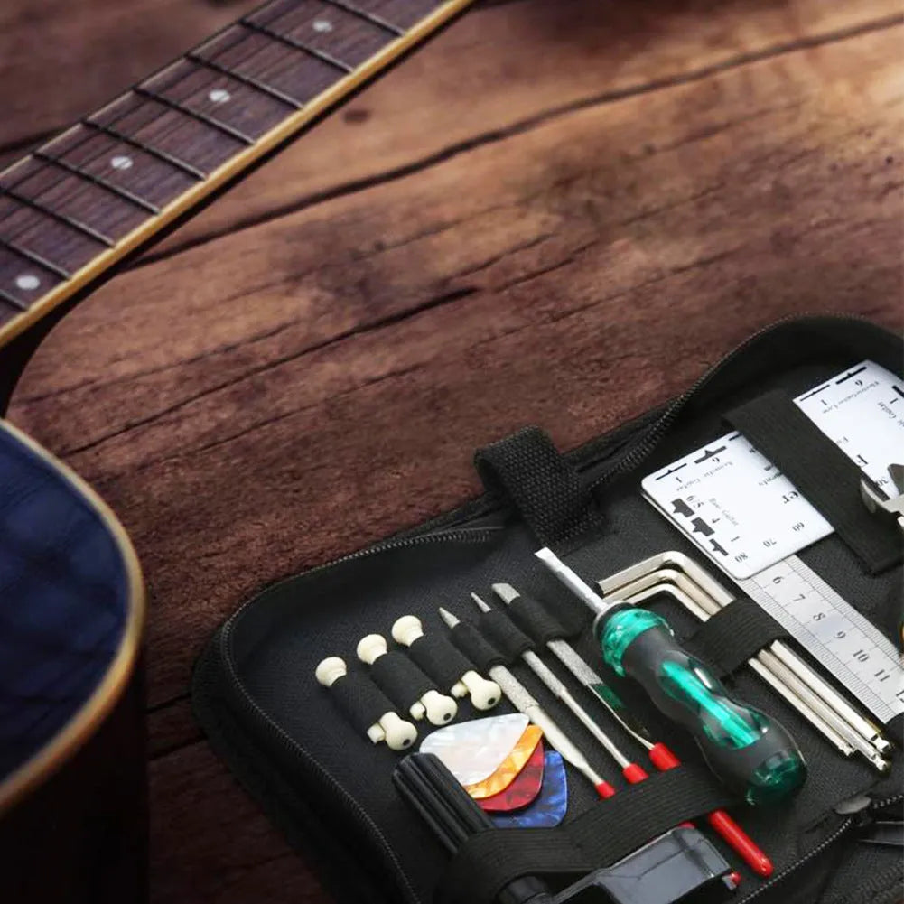 Black case open to reveal a guitar repair and care tool kit for instrument maintenance.