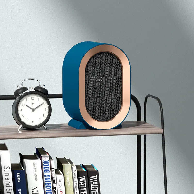 Black desktop electric heater with ceramic heating element and mechanical controls