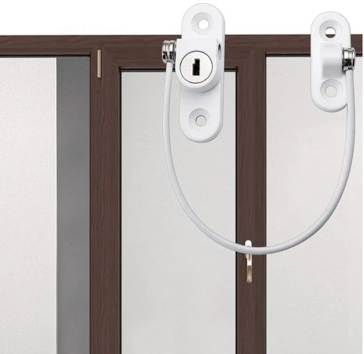 White window security chain lock with 18cm steel cable and locking head on a window frame