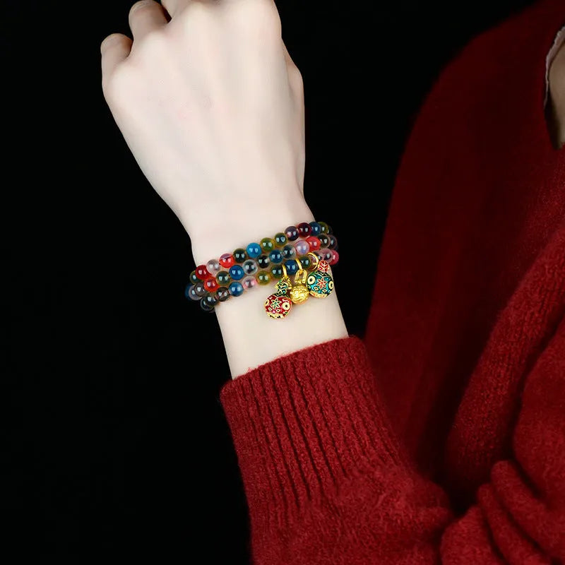 Dzogchen agate bracelet with gray glaze and gold beast decorative elements