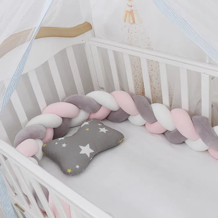 Spandex crystal velvet baby cot bumper in grey pink colour, shown flexible and long.