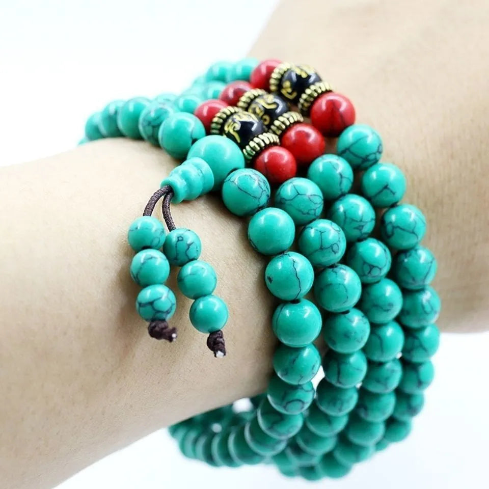 Turquoise-coloured 108 bead Buddhist Mala bracelet with round polished beads on adjustable string