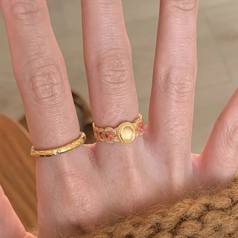 Geometric open band women's ring with pink crystal enamel on copper gold plating, colour K227.
