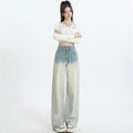 Gradient blue straight-leg denim trousers for women on a hanger, showing the wide-leg cut and colour fade.