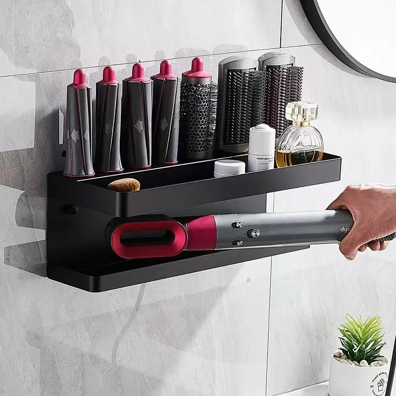 White double-layer punch-free aluminium rack holding hair curlers on a bathroom wall.