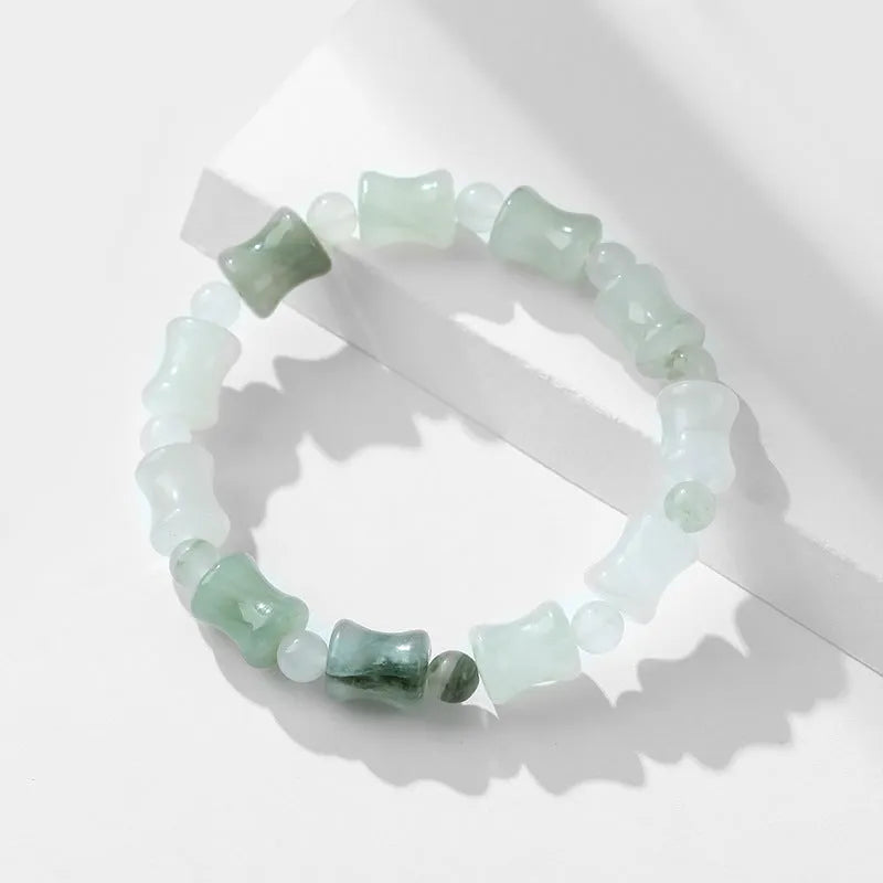 Natural chalcedony beaded bracelet with safety lock closure and diamond-shaped jade beads on elastic string