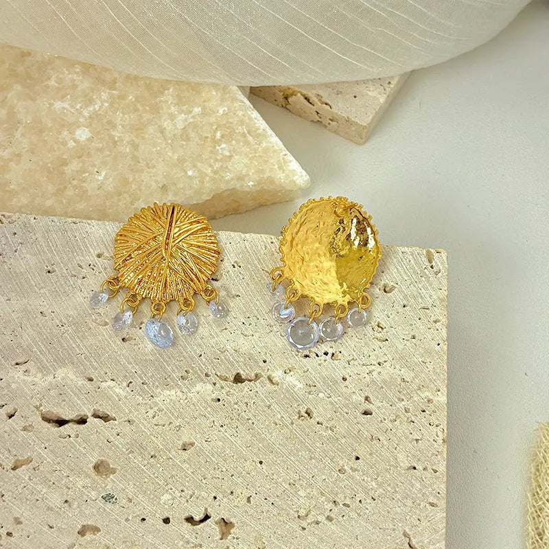 Women's gold geometric hoop earrings with round elements and electroplated finish