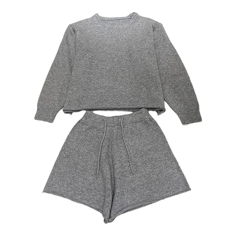 Women's knitted loose-fitting sweater and wide-leg shorts two-piece set in a neutral colour.