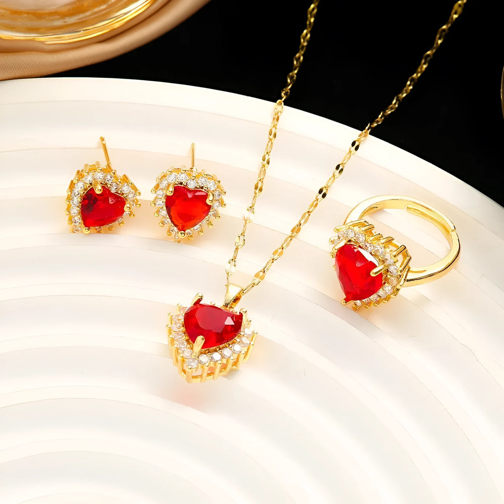 Gold red titanium steel jewellery set with heart and flower pendant necklace, stud earrings, and ring.