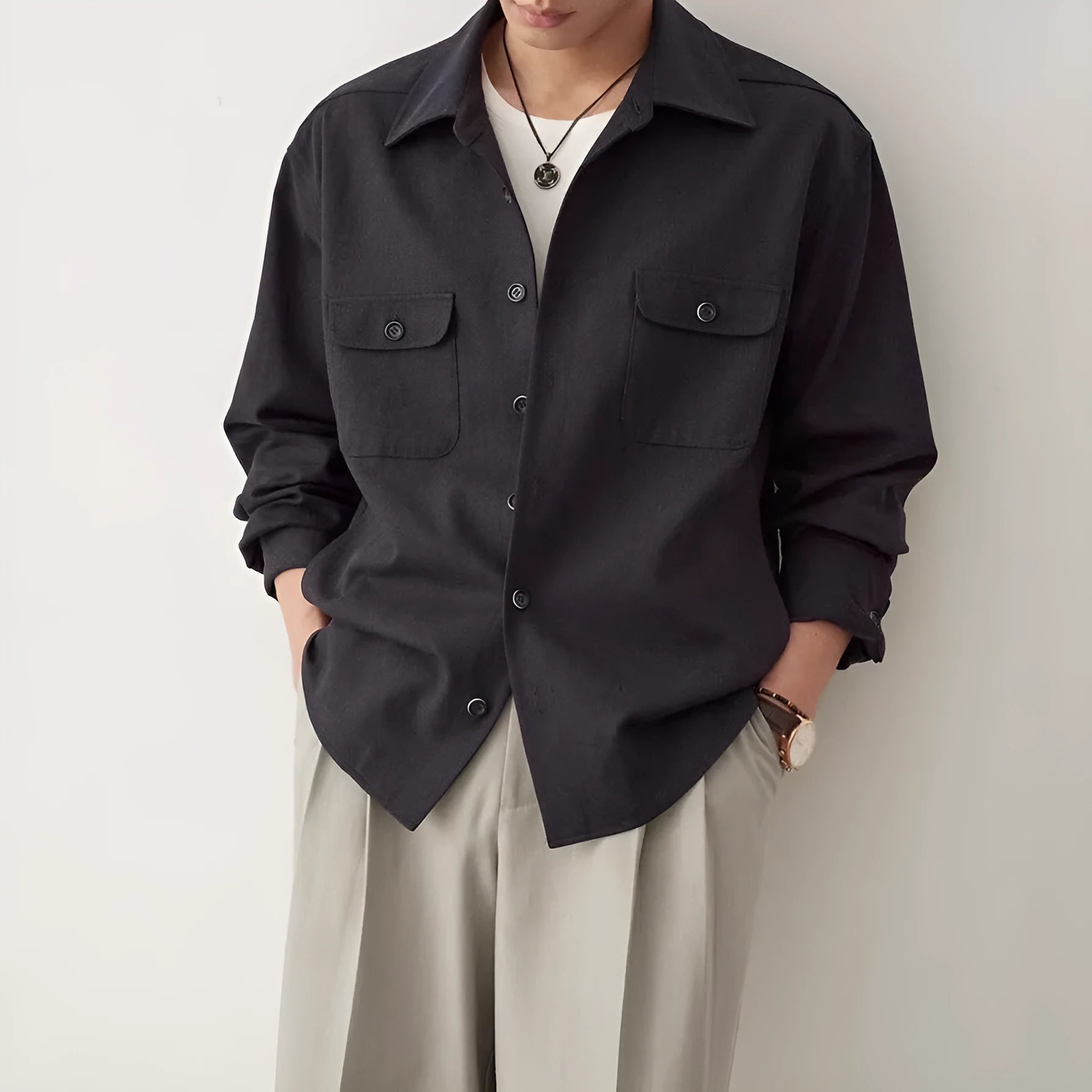 Men's casual shirt with a cotton lapel in light sand rice colour, showing long sleeves and simple design.