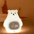 Big White Bear cartoon silicone night light with remote control on a bedside table.