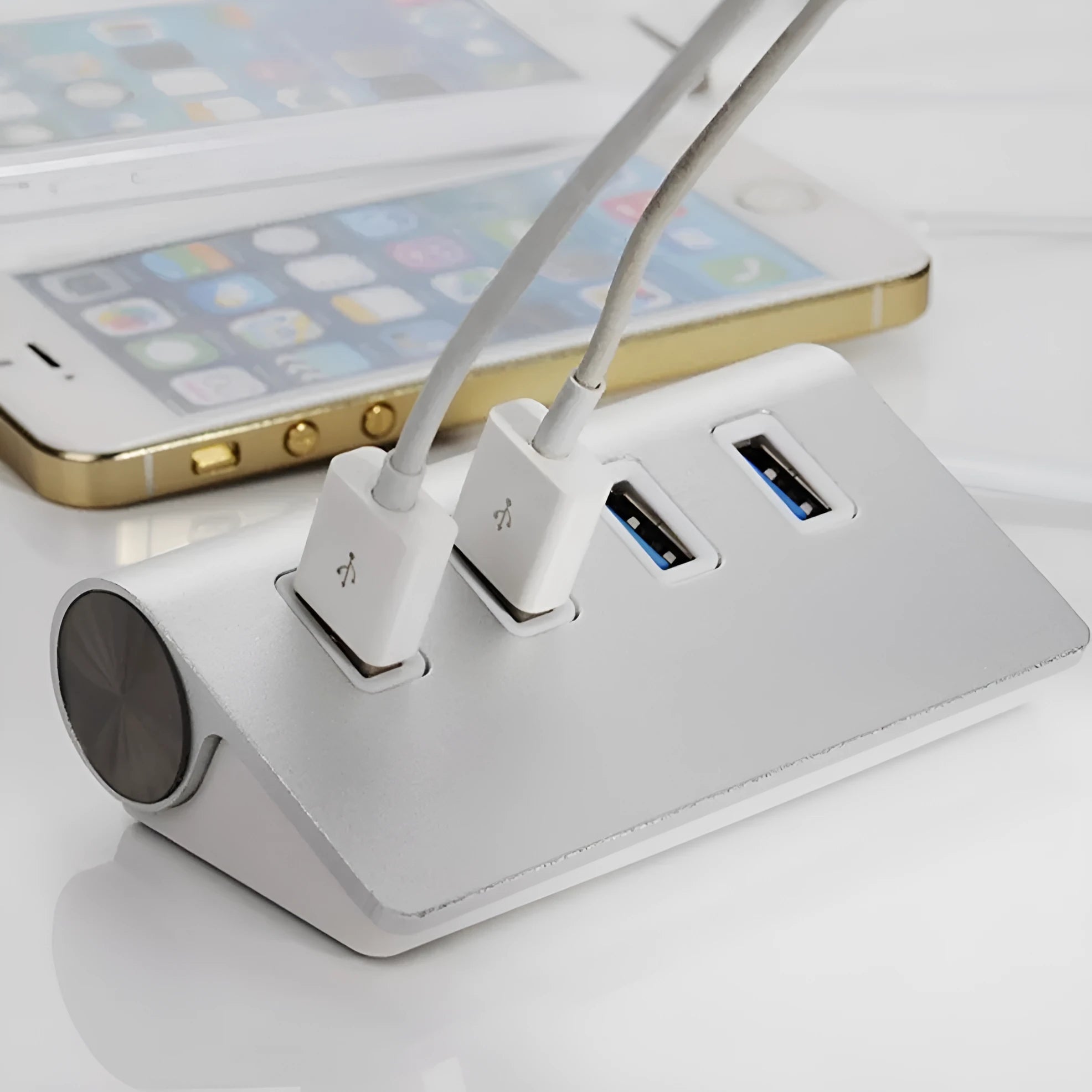 Silver aluminium alloy four-port USB 3.0 hub on a desk with cables connected, 98x58x30mm