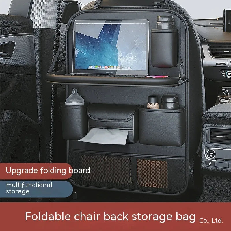 Car seat storage bag with foldable table in leather, hanging behind vehicle seat