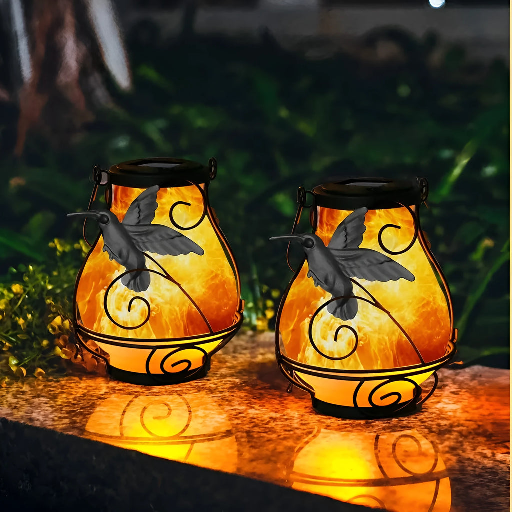 Solar courtyard light with butterfly flame motif, IP55 outdoor rating