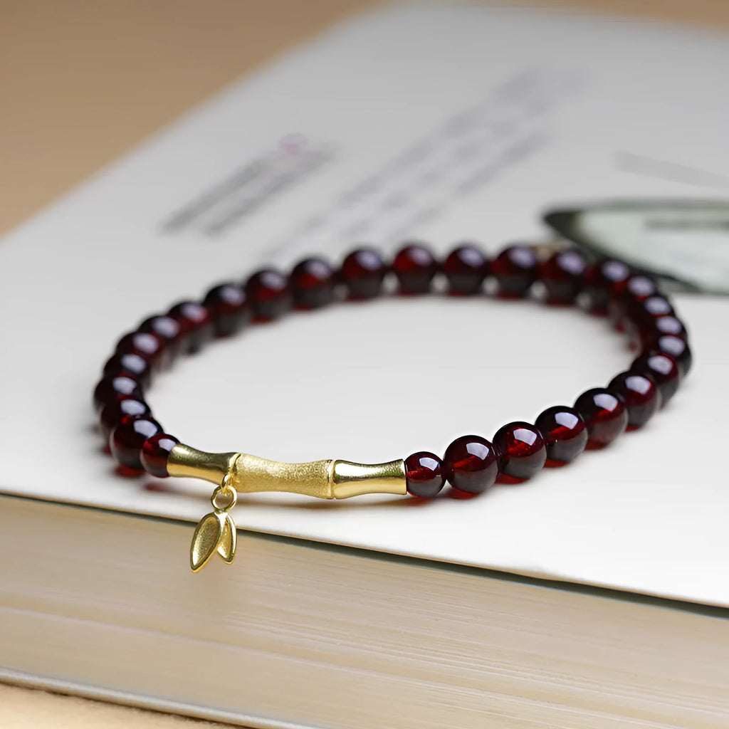 Single ring bamboo joint bracelet with 6mm natural garnet bead in copper or silver finish