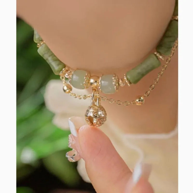 Women's natural Hetian jade bamboo bracelet on white background, adjustable 15+3 cm size