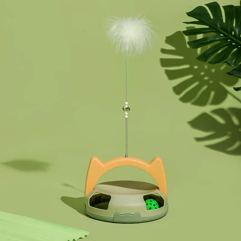 Blue and pink cat toy stick with spinning ball on a nylon wand, showing replaceable head.