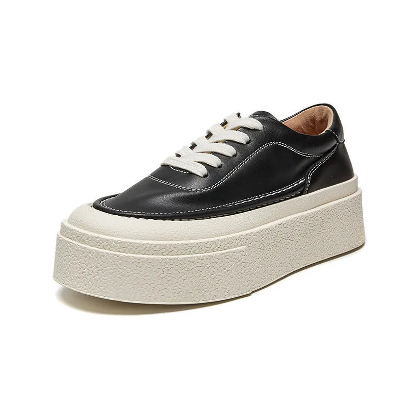 Women's black embossed cowhide platform sports board shoes with a rubber sole.