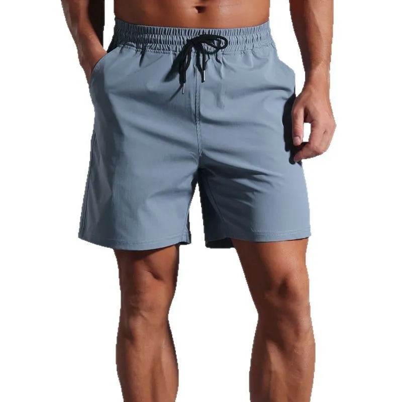Men's loose-fit casual shorts in quick-dry polyester, shown in black, blue, khaki, or purplish red.
