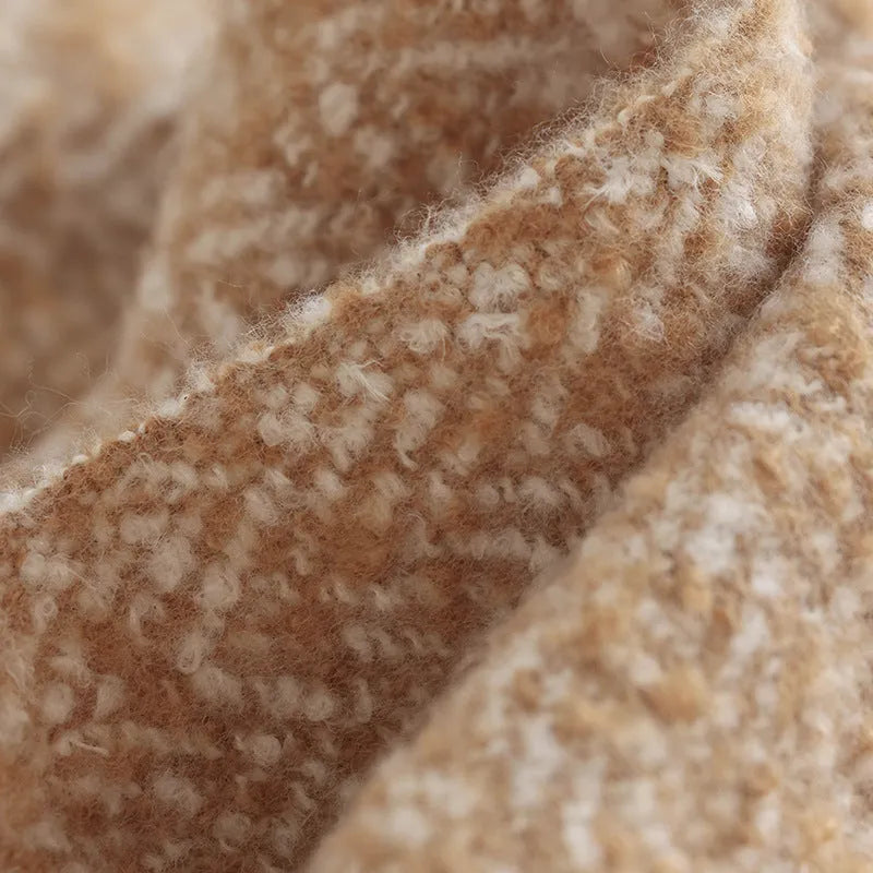 Polyester sofa blanket 120x170cm in khaki folded on a modern sofa