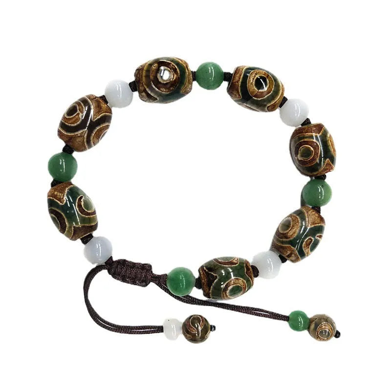 Green agate Tibetan bracelet with three-eye geometric bead pattern and adjustable cord closure