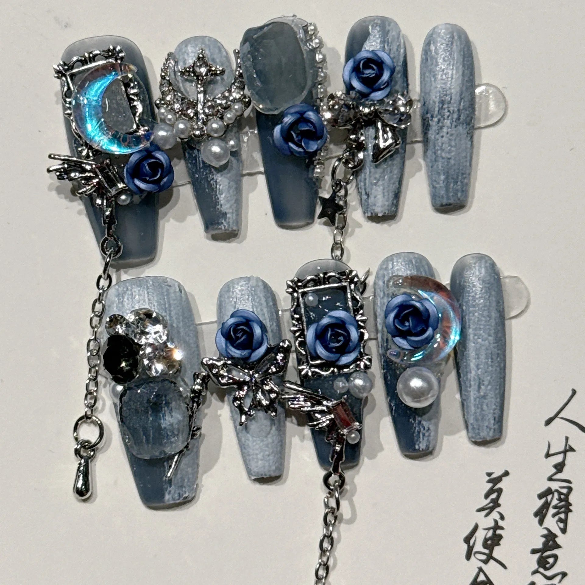 Blue plastic nail armour suit with rose and tulip patterns for evening wear.