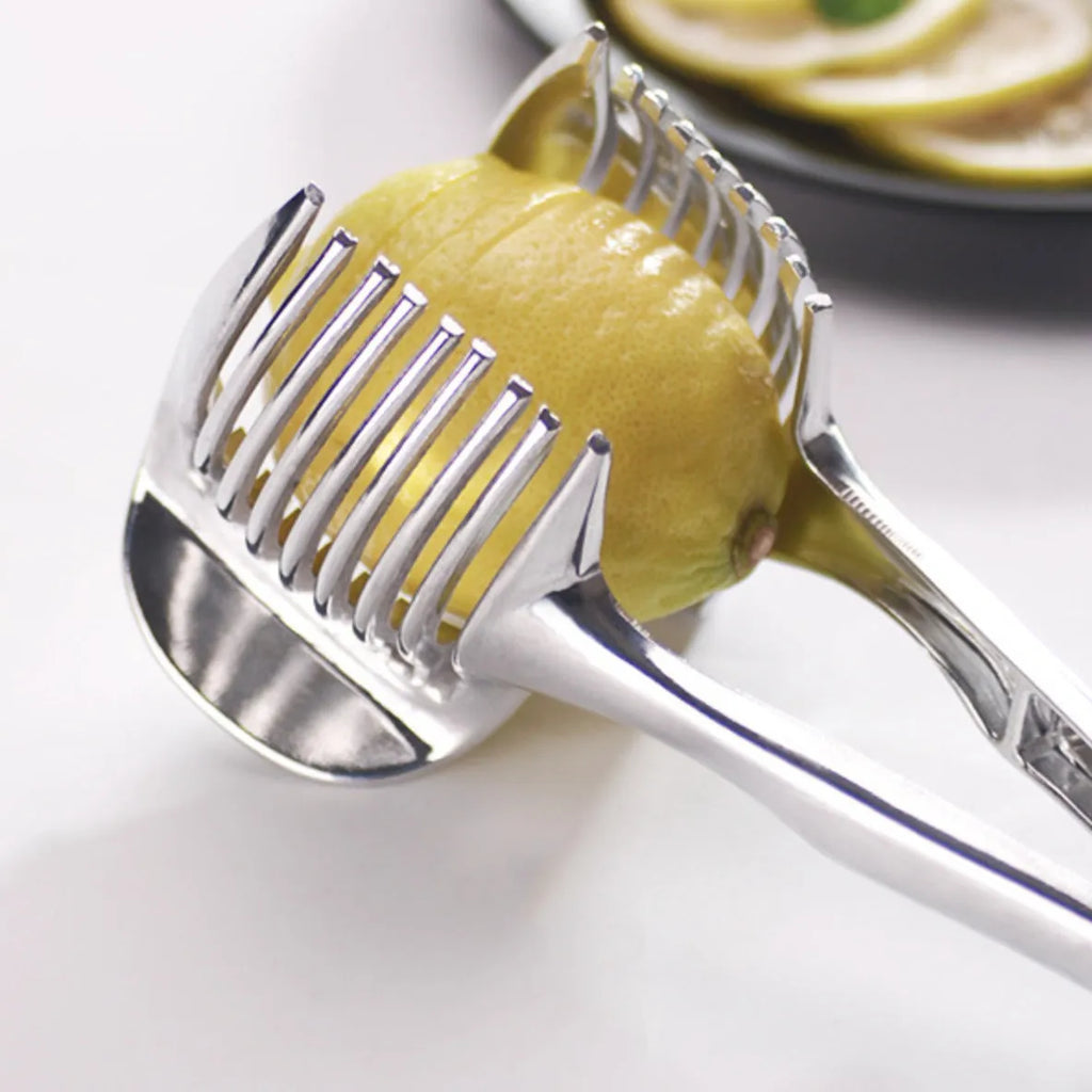 Silver plastic foldable lemon and fruit slicer kitchen gadget shown open for use