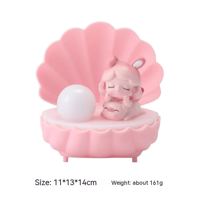 Cartoon character resin night light with shell star design on tabletop