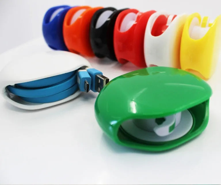 Automatic earphone cable retractor winder in multiple colours on a white background.