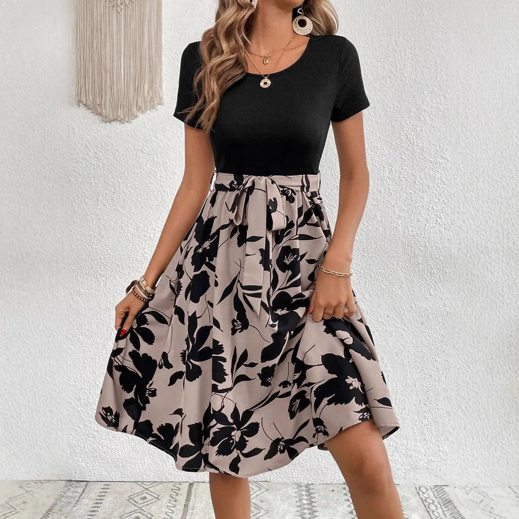 Khaki women's A-line dress with a floral print pattern and a lace-up shoulder strap detail.
