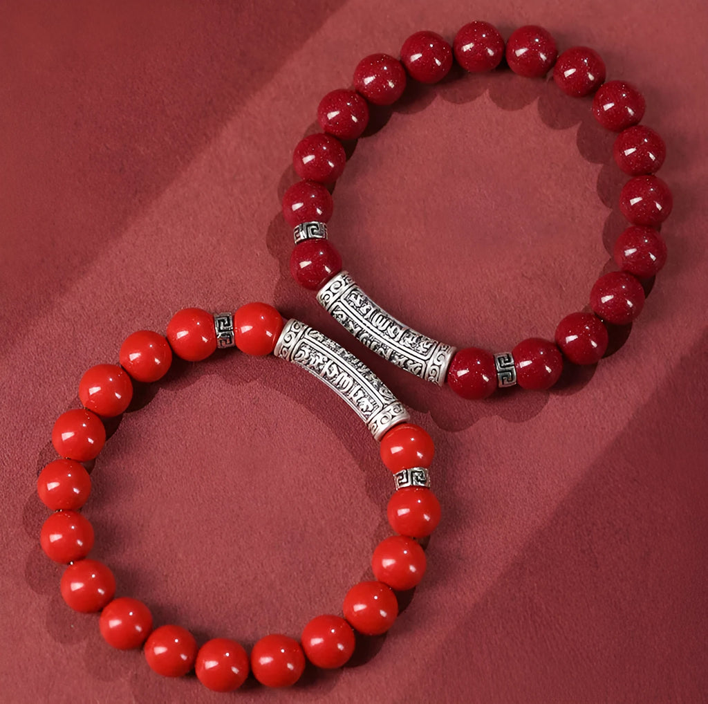 Handmade cinnabar sandstone bracelet in purple gold sand colour with 8mm beads on a wrist.