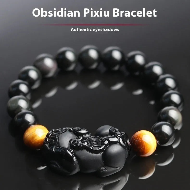 Mexico gold sheen obsidian Pi Xiu bracelet in unisex ethnic style on a wrist.