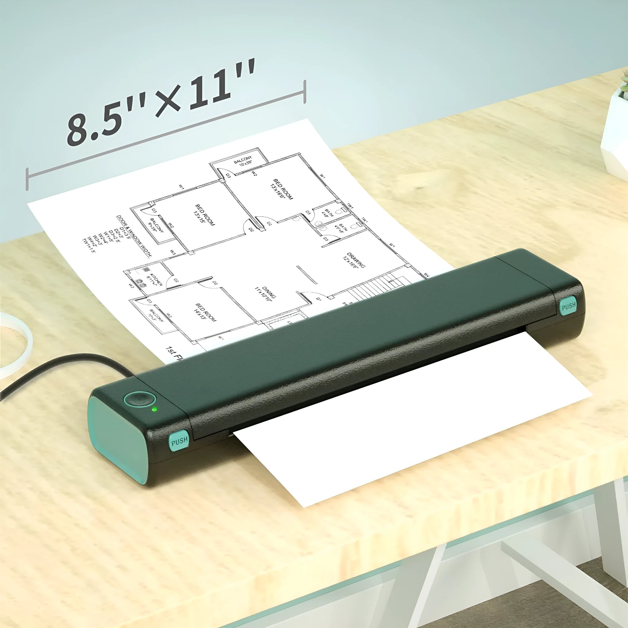 Phomemo M08F white portable A4 thermal printer on a desk next to a mobile phone.