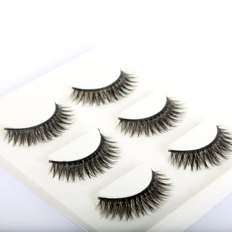 Self-adhesive false eyelashes set with natural curly long section, 0.5cm to 1cm length, on a white tray